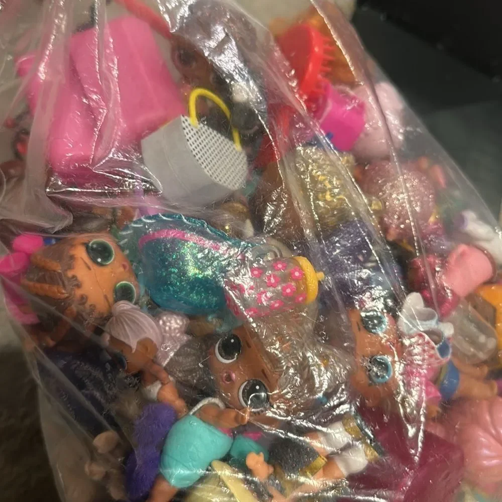 Almost 5lb of Lol dolls , dolls accessories , clothes and some furniture big lot